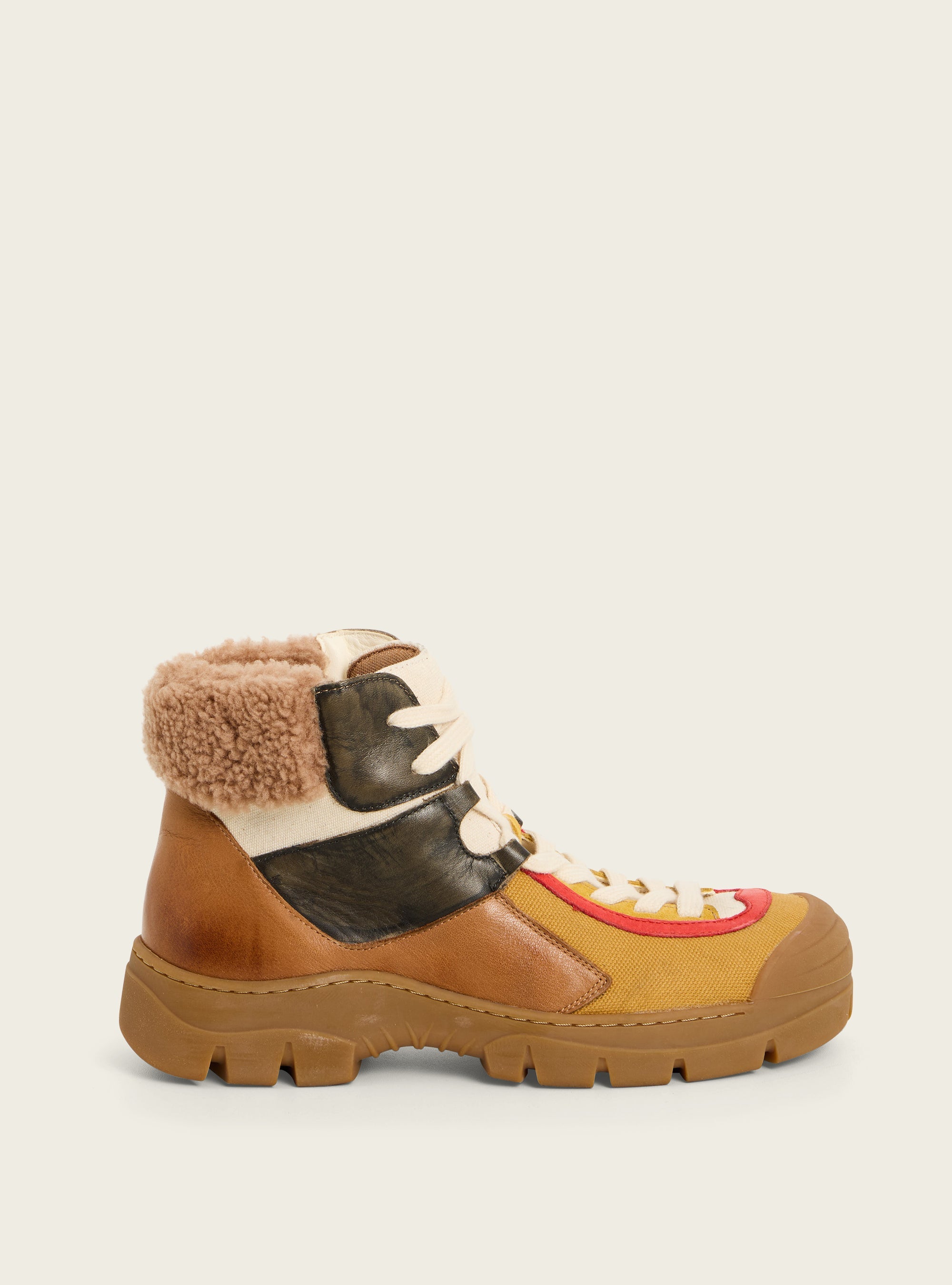 Bottillons en cuir et toile acoté