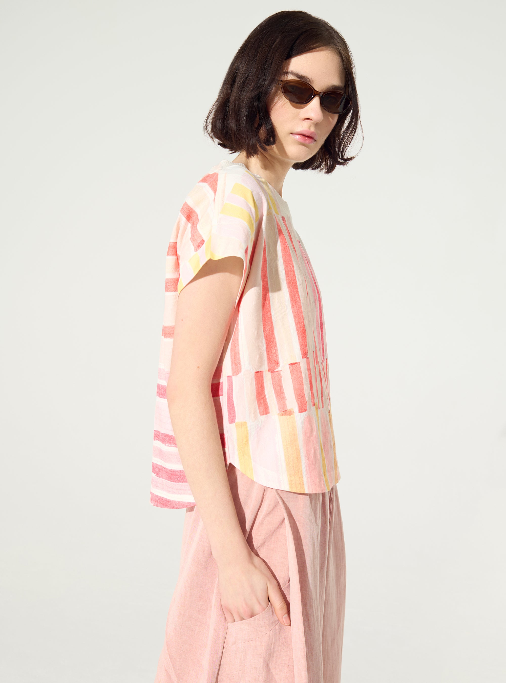 Pleated and embellished red blouse