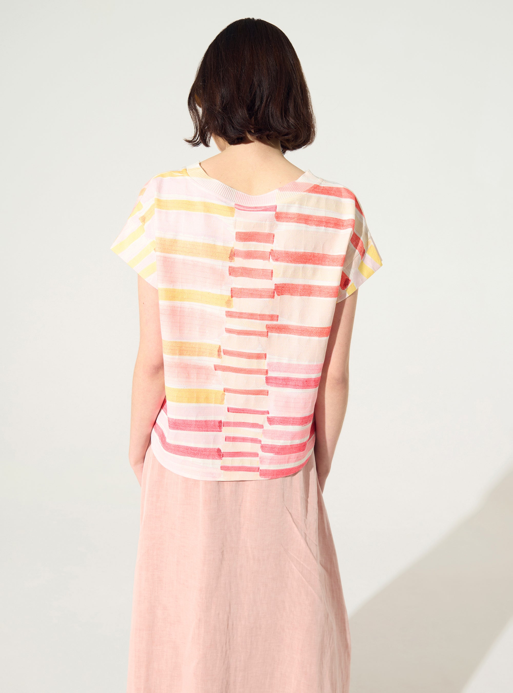 Pleated and embellished red blouse