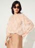 loose-fitting pleated pink lace blouse